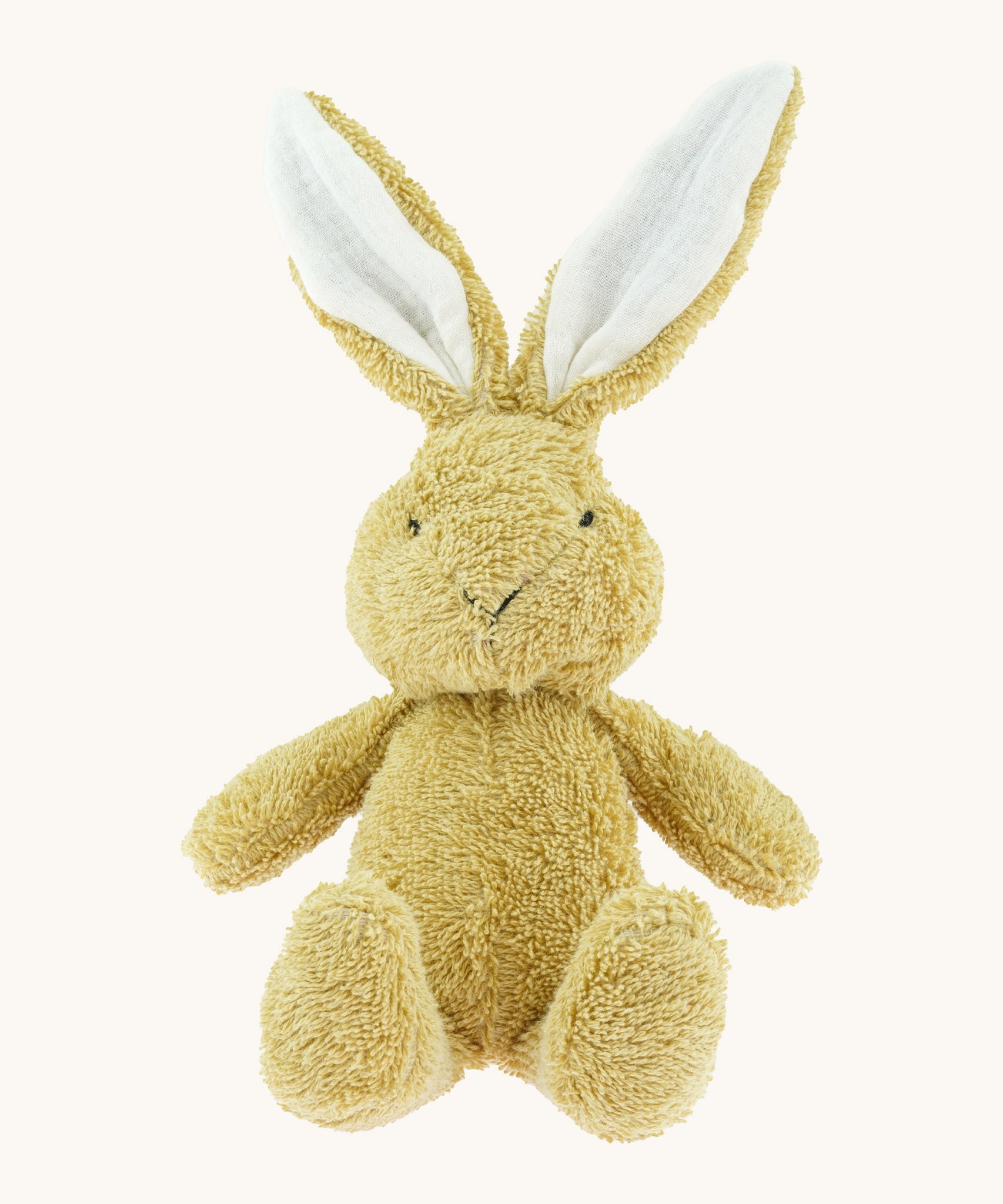 A small Wooly Organic soft bunny rabbit in amber available at Babipur. A soft cotton light brown rabbit with cute facial features and floppy ears