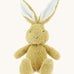 A small Wooly Organic soft bunny rabbit in amber available at Babipur. A soft cotton light brown rabbit with cute facial features and floppy ears