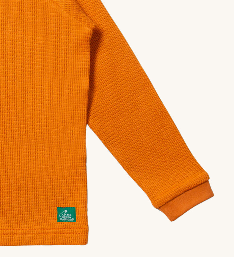 A closer look at the waffle texture fabric of the LGR Long Sleeve Waffle Top - Golden Ochre