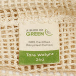A close up view of the A Slice Of Green small mesh recycled cotton produce bag showing the mesh detail. Features a tag showing the total carry weight and recycled cotton certification 