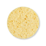 A Slice of Green natural cellulose facial cleansing sponge on a white background
