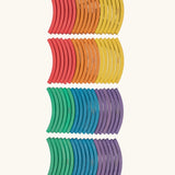 Set of 72 Abel curved wooden blocks in rainbow colors, including yellow, orange, red, purple, blue and green. 12 blocks in each colour. 