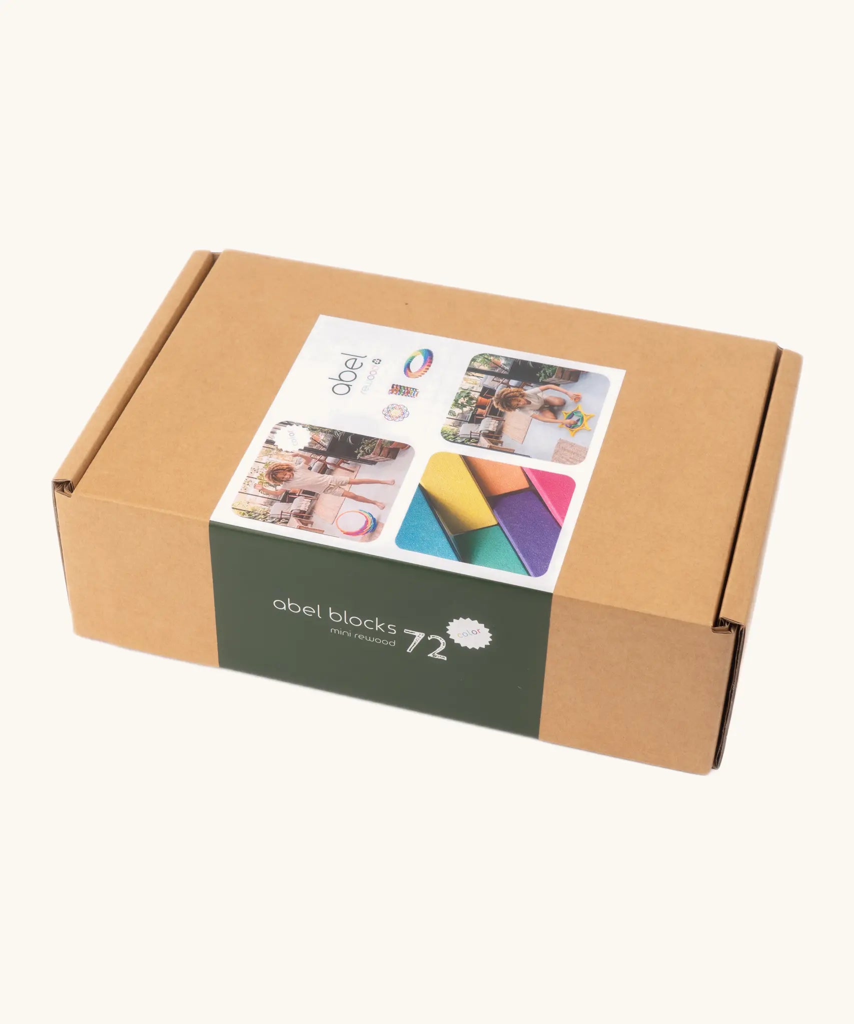 Set of 72 Abel curved wooden blocks in rainbow colors, including yellow, orange, red, purple, blue and green in their cardboard packaging box.