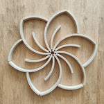 The set of 24 Abel Mini Re-Wood blocks placed in a mandala pattern.