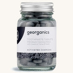 A jar of the Georganics activated charcoal toothpaste tablets