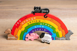 Alphabet Jigsaw plastic-free wooden Rainbow puzzle toy stood up on a wooden floor background