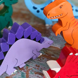 All Alphabet Jigsaws handmade wooden dinosaur figures with magnets, used in small-world play. 