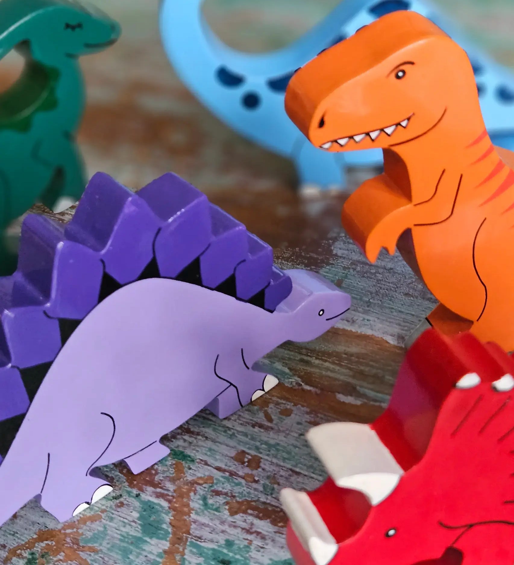 All Alphabet Jigsaws handmade wooden dinosaur figures with magnets, used in small-world play. 