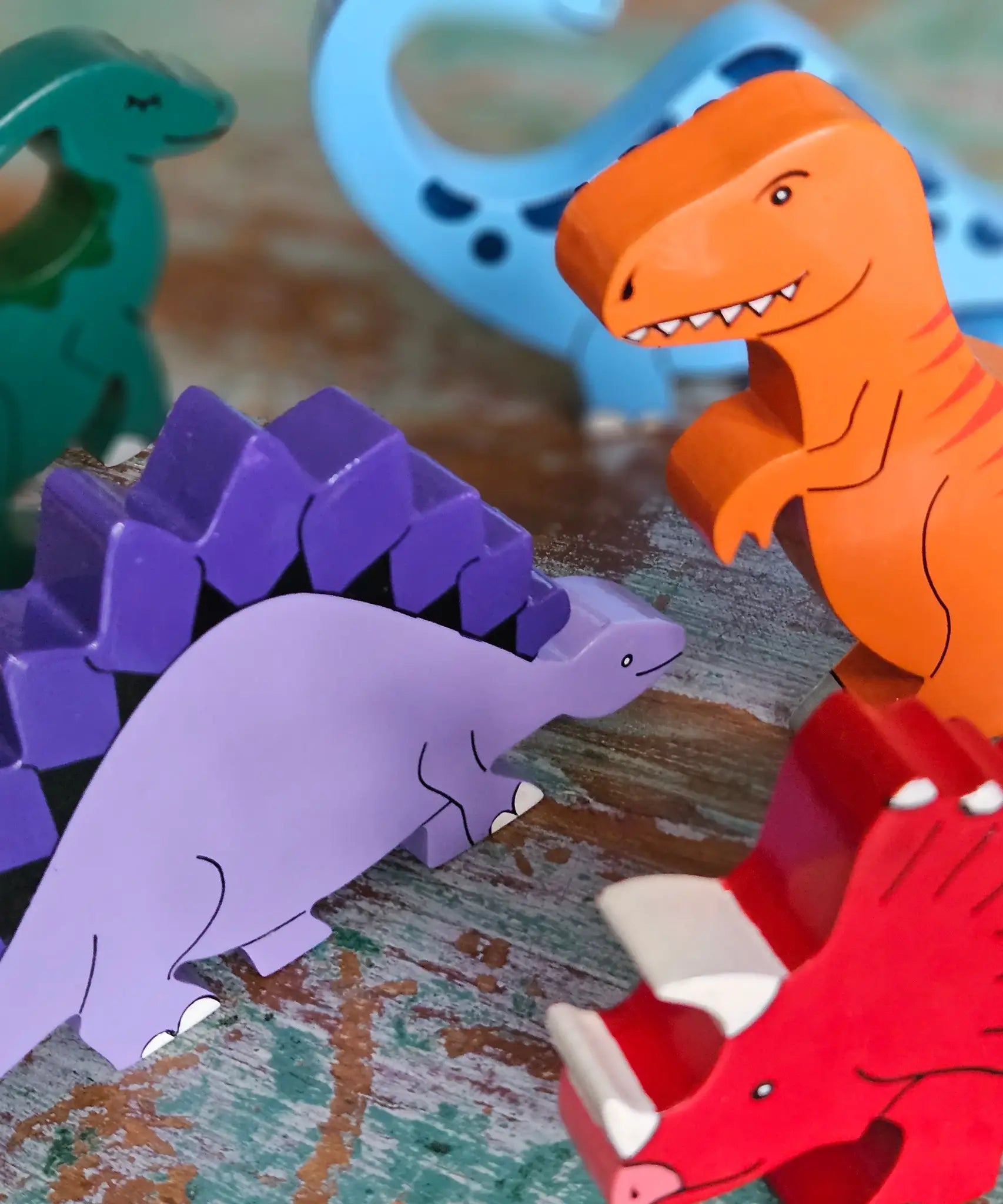 All Alphabet Jigsaws handmade wooden dinosaur figures with magnets, used in small-world play. 