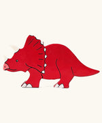 Triceratops wooden magnetic dinosaur figure by Alphabet Jigsaws, with hand painted non-toxic red body.