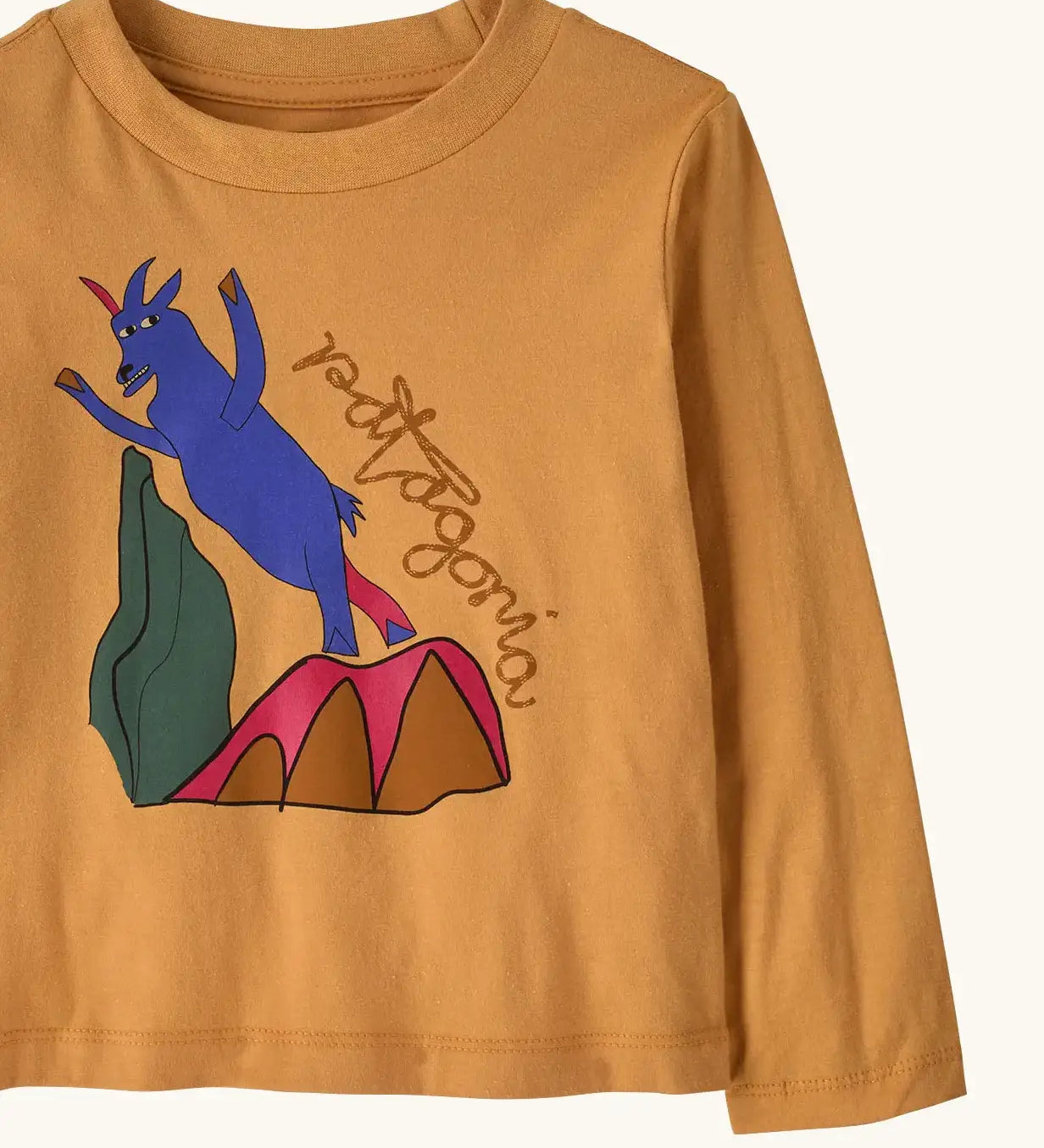 Front of Patagonia's  little kids long sleeve t-shirt in mango orange showing close up of  blue mountain goat print 