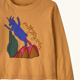 Front of Patagonia's  little kids long sleeve t-shirt in mango orange showing close up of  blue mountain goat print 