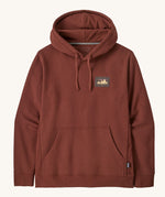 Patagonia Fitz Roy uprisal adult hoody. A burnt red coloured hoodie which features a adjustable drawstring on the hood and a pouch pocket on the front. Also features a brand patch l on the left chest