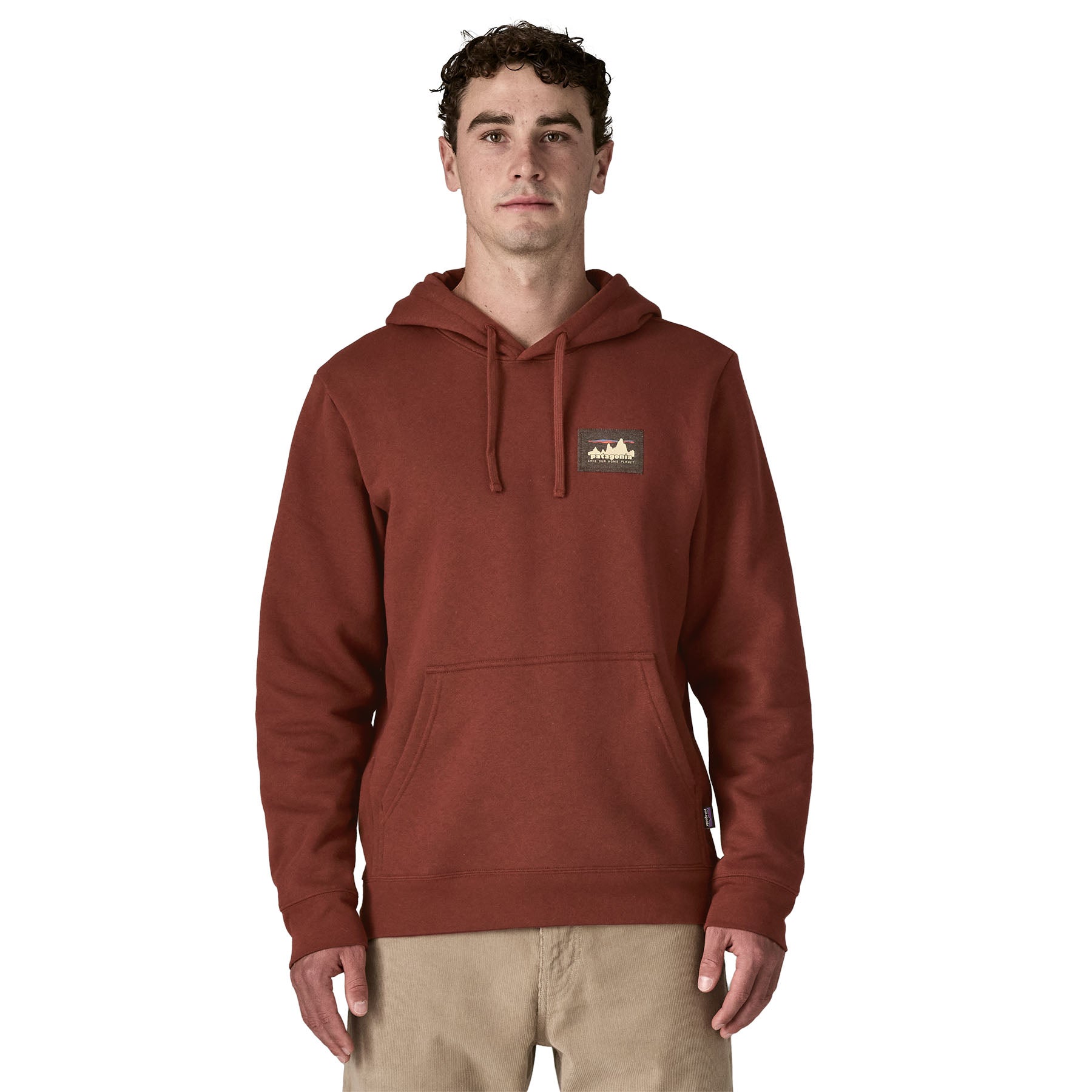 A man wearing the Patagonia Fitz Roy uprisal adult hoody in dried vanilla colour available at Babipur.