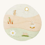A wild chamomile Avery Row activity play mat with a rabbit, carrot a teacup and flower on top of the play mat on a cream background.