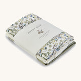 A soft Avery Row muslin sqauare set of 3 including a flower design, light  and a green muslin square on a cream background