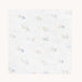 Avery Row Coastline baby Muslin Swaddle. The swaddle features a delicate coastline print that has corals and little blue fish. Avery Row have a collection of stylish nursery and baby essentials available at Babipur.