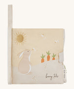 A soft beige Avery row baby book with a rabbit on the cover on a cream background.