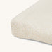 A Avery row changing cushion cover with a daisy flower design on a cream background.
