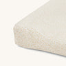 A Avery row changing cushion cover with a daisy flower design on a cream background.