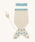 A light Avery row mermaid dress up set with a light blue trim including a light blue crown and a light shell wand on a cream background.