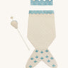 A light Avery row mermaid dress up set with a light blue trim including a light blue crown and a light shell wand on a cream background.