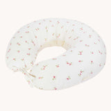 An Avery Row Nursing Pillow with an Anemone design. The The top of the pillow features a white background with a delicate pink anemone flower print. Avery Row have a range of baby and nursery products with stylish designs available at Babipur. 