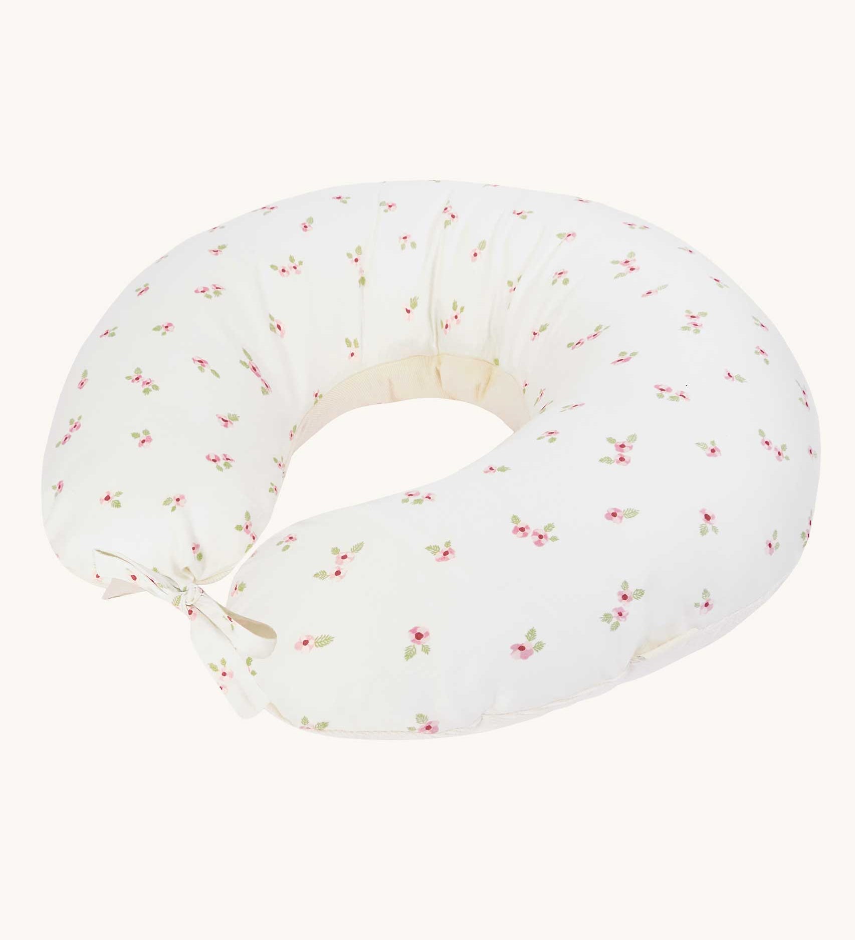 An Avery Row Nursing Pillow with an Anemone design. The The top of the pillow features a white background with a delicate pink anemone flower print. Avery Row have a range of baby and nursery products with stylish designs available at Babipur. 