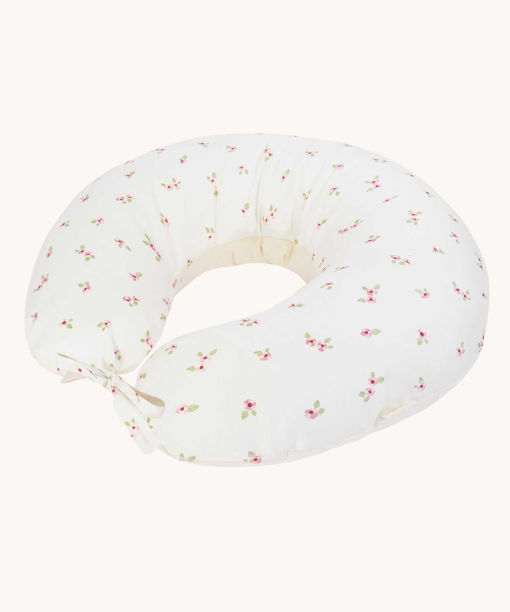 An Avery Row Nursing Pillow with an Anemone design. The The top of the pillow features a white background with a delicate pink anemone flower print. Avery Row have a range of baby and nursery products with stylish designs available at Babipur. 