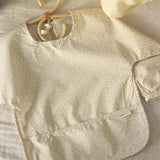 Avery Row Sleeved Bib - Daisy Meadow
