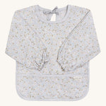 A light blue coloured Avery Row long sleeve bib with a nature design on s cream background.