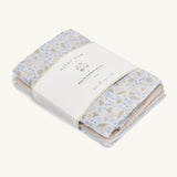 A soft Avery row muslin squares set of 3 including a light blue with a nature design, beige and light blue muslins on a cream background.