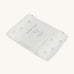 A soft light coloured Avery Row muslin square with a nettle design on a cream background.