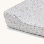 A close up of the light blue Avery Row changing cushion cover with a nature design on a cream background.