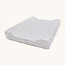 A light blue Avery Row changing pillow with a nature design on a cream background.