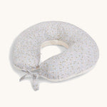 A soft light blue Avery Row nursing pillow with a nature design on a cream background.