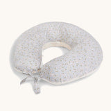 A soft light blue Avery Row nursing pillow with a nature design on a cream background.