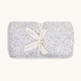 A soft light blue coloured Avery Row playmat with a nature design on a cream background.
