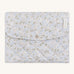 A soft light blue coloured Avery Row travel changing mat with a nature design on a cream background.