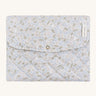 A soft light blue coloured Avery Row travel changing mat with a nature design on a cream background.