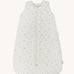 A light Avery row baby sleeping bag with a nettle design on the front on a cream background.