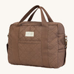 A brown nutmeg Avery Row baby changing bag on a cream background.