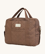 A brown nutmeg Avery Row baby changing bag on a cream background.