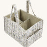 A soft Avery Row nappy caddy organiser with a flower design on a cream background.