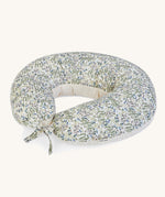 A soft Avery Row nursing pillow with a flower design on a cream background.
