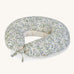 A soft Avery Row nursing pillow with a flower design on a cream background.