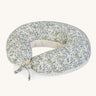 A soft Avery Row nursing pillow with a flower design on a cream background.