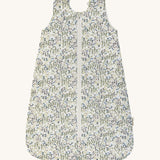 A Avery row baby sleeping bag with a flower design on the front on a cream background.