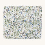 A soft Avery Row travel changing mat with a flower design  on a cream background.