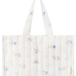 The Avery Row Organic Cotton Nappy Caddy Organiser - Coastlines full of baby products for changing time. This image shows the different inside compartments and how many products can be stored inside the nappy caddy